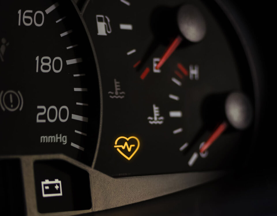 Check-engine light symbol representing early warning signs of cardiovascular risk detected by the Pulse arterial health monitor.