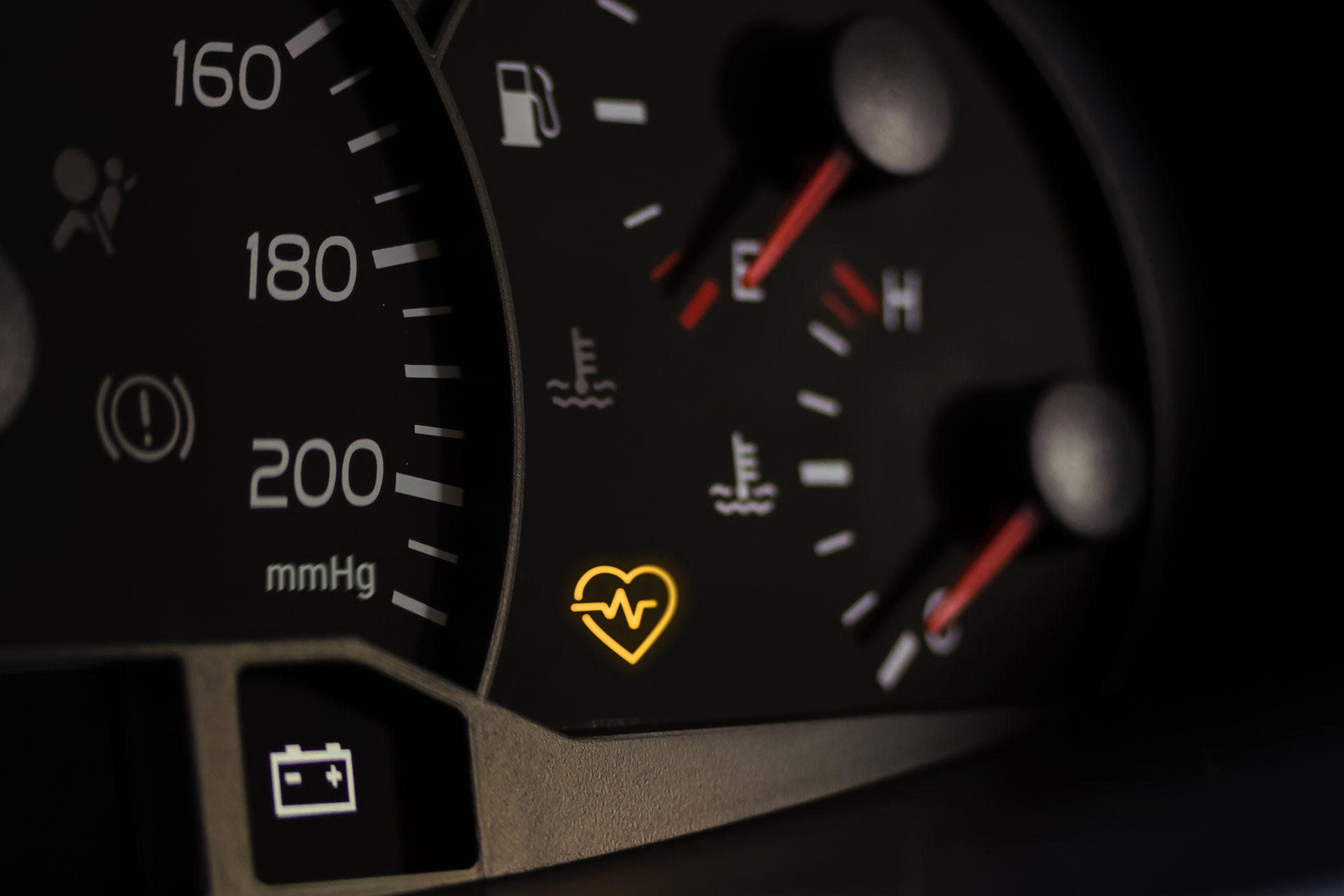 Check-engine light symbol representing early warning signs of cardiovascular risk detected by the Pulse arterial health monitor.
