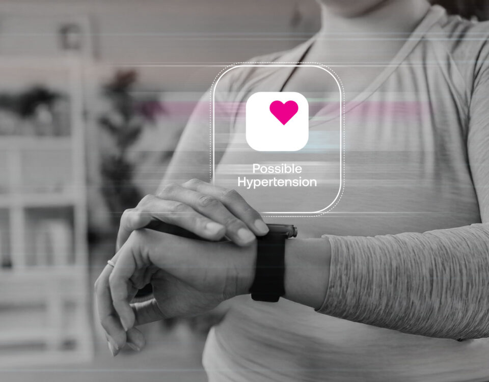 Woman checking her Apple Watch after receiving a possible hypertension notification.