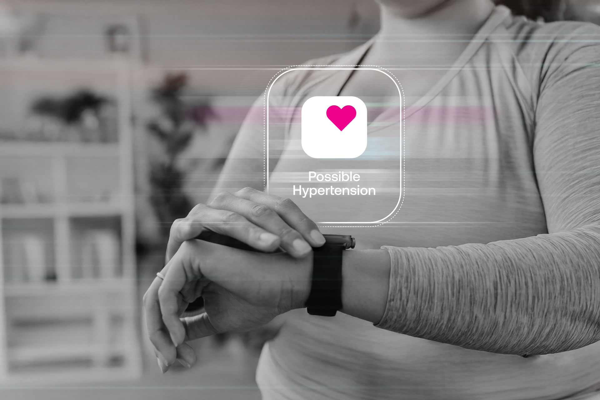 Woman checking her Apple Watch after receiving a possible hypertension notification.