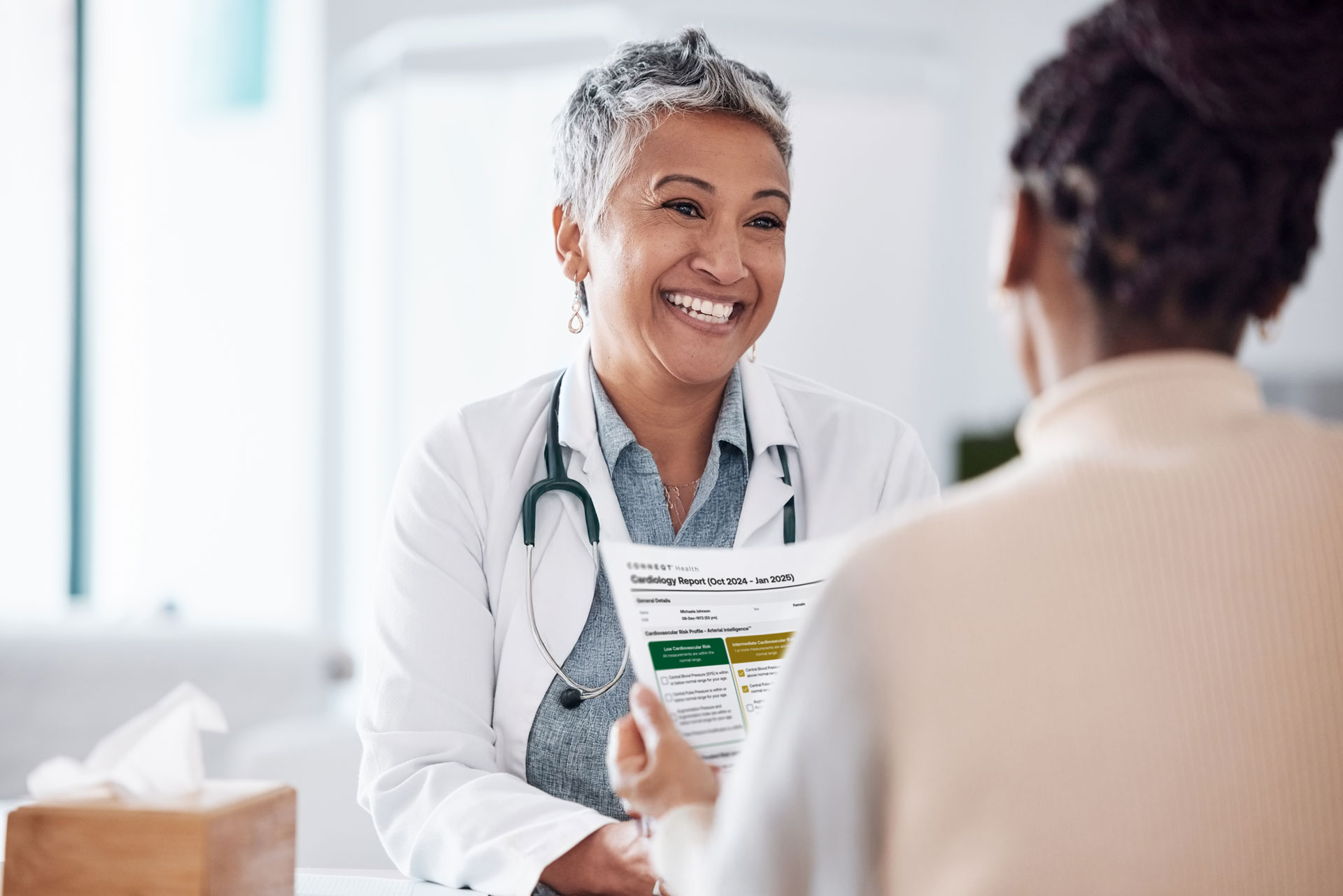 A doctor and patient reviewing health data together, showing how to talk to your doctor with more clarity and confidence.
